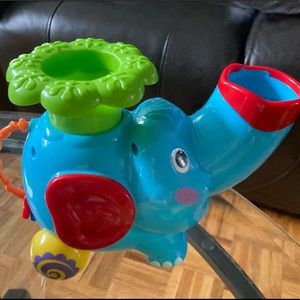 Musical elephant with balls and batteries